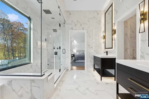 a spacious bathroom with a shower and a sink