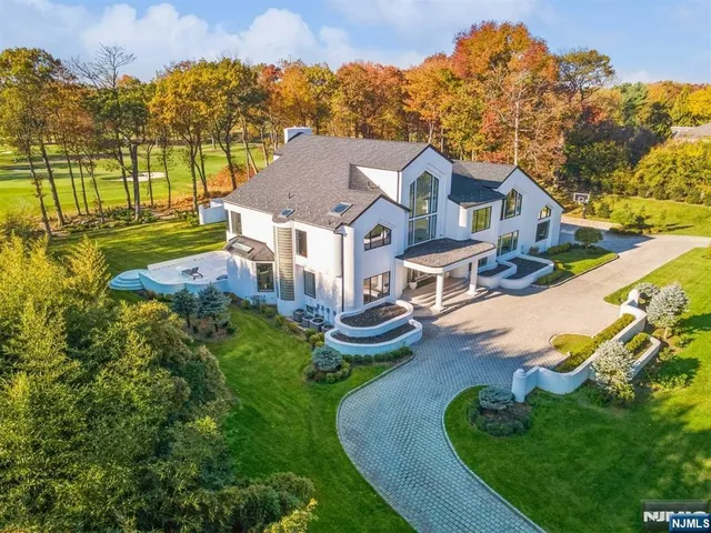 an aerial view of a house with garden view