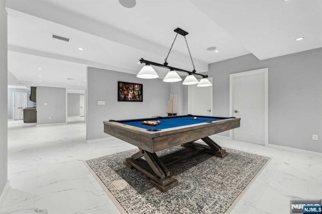 23 Rio Vista Drive Alpine, NJ 07620 - Photo 36 of 47 a living room with a table chairs and a table