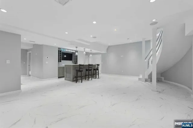 a view of kitchen with furniture and refrigerator