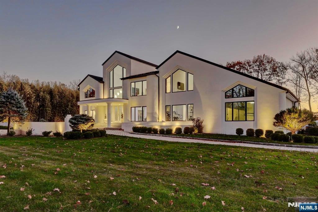 23 Rio Vista Drive Alpine, NJ 07620 - Photo 4 of 47 a front view of a house with a yard