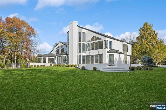 a big house with a big yard and more trees