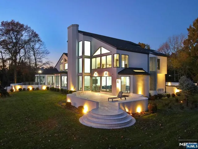 a front view of a house with a yard fountain and fountain