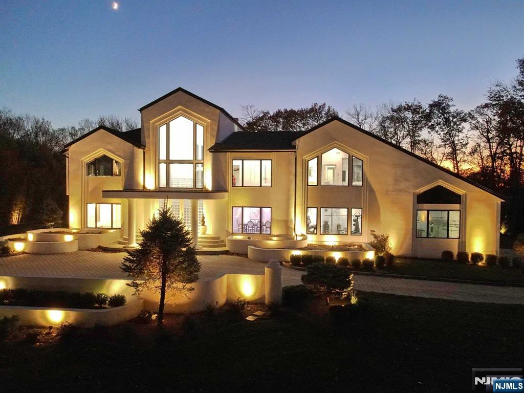 23 Rio Vista Drive Alpine, NJ 07620 - Photo 5 of 47 a front view of a house with a yard