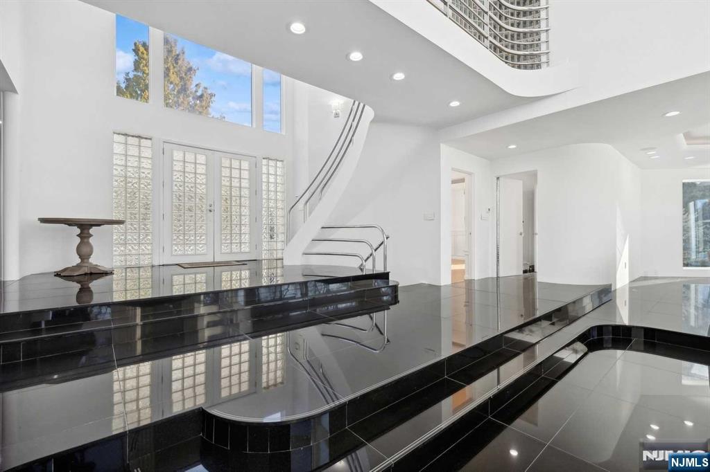 23 Rio Vista Drive Alpine, NJ 07620 - Photo 6 of 47 a large kitchen with stainless steel appliances a large counter top