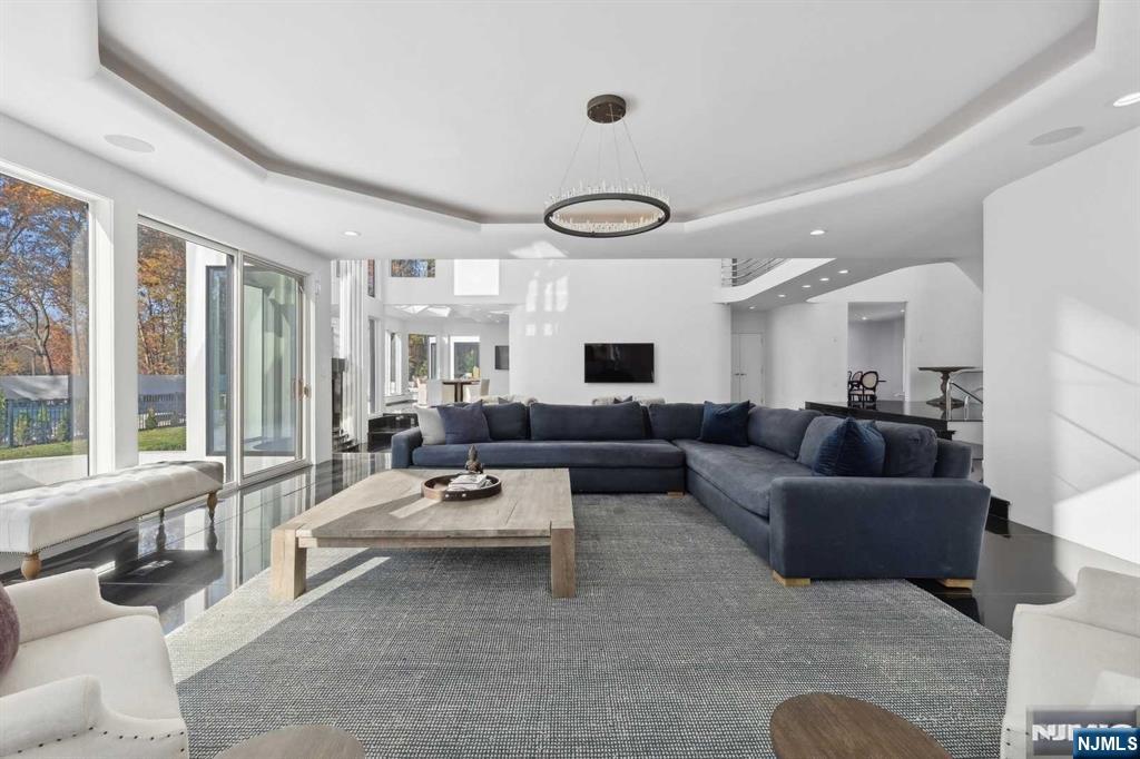 23 Rio Vista Drive Alpine, NJ 07620 - Photo 9 of 47 a living room with furniture and large windows