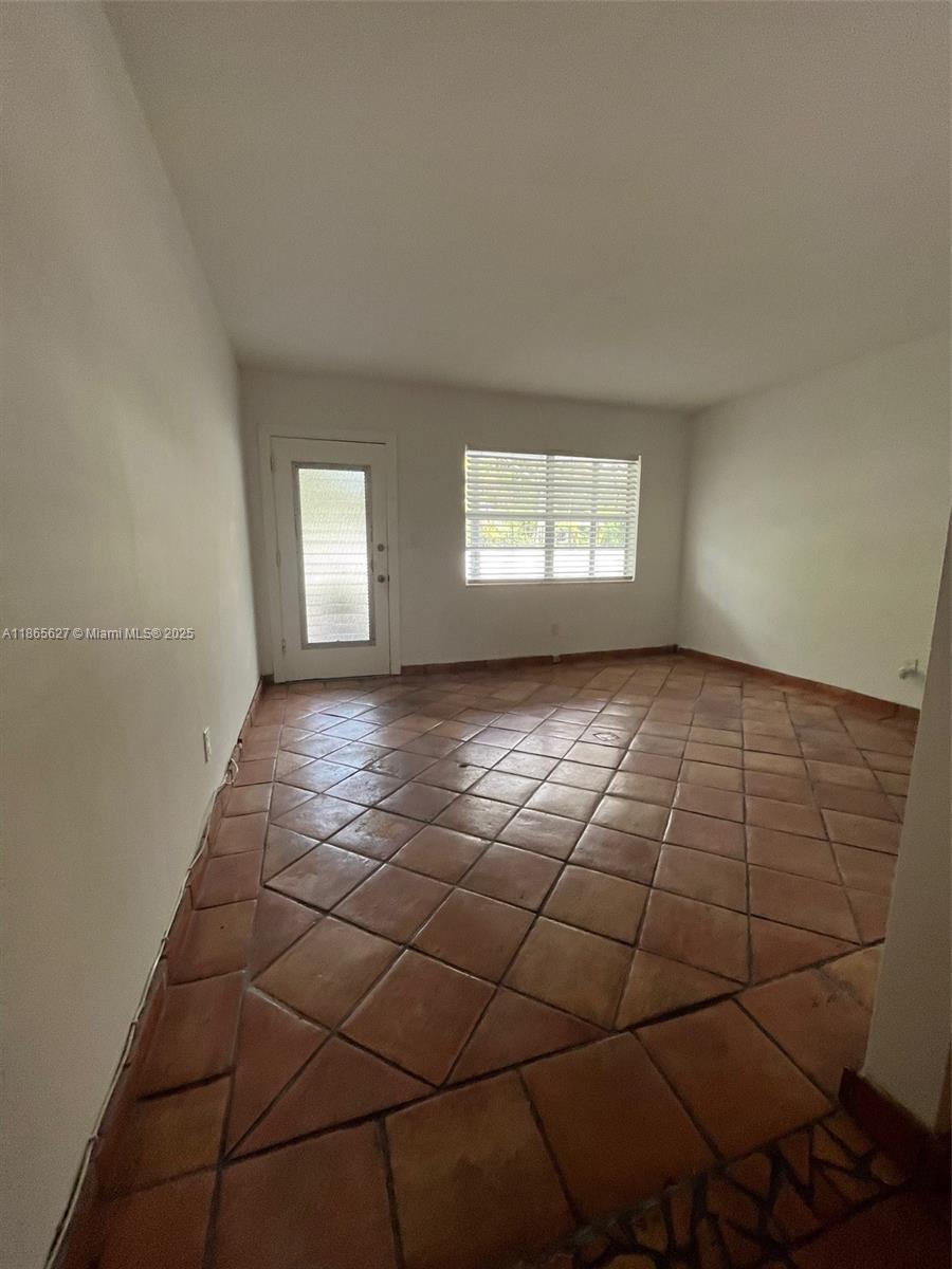 645 Northeast 77th Street, Unit 6 Miami, FL 33138 - Photo 6 of 10 a view of an empty room and window