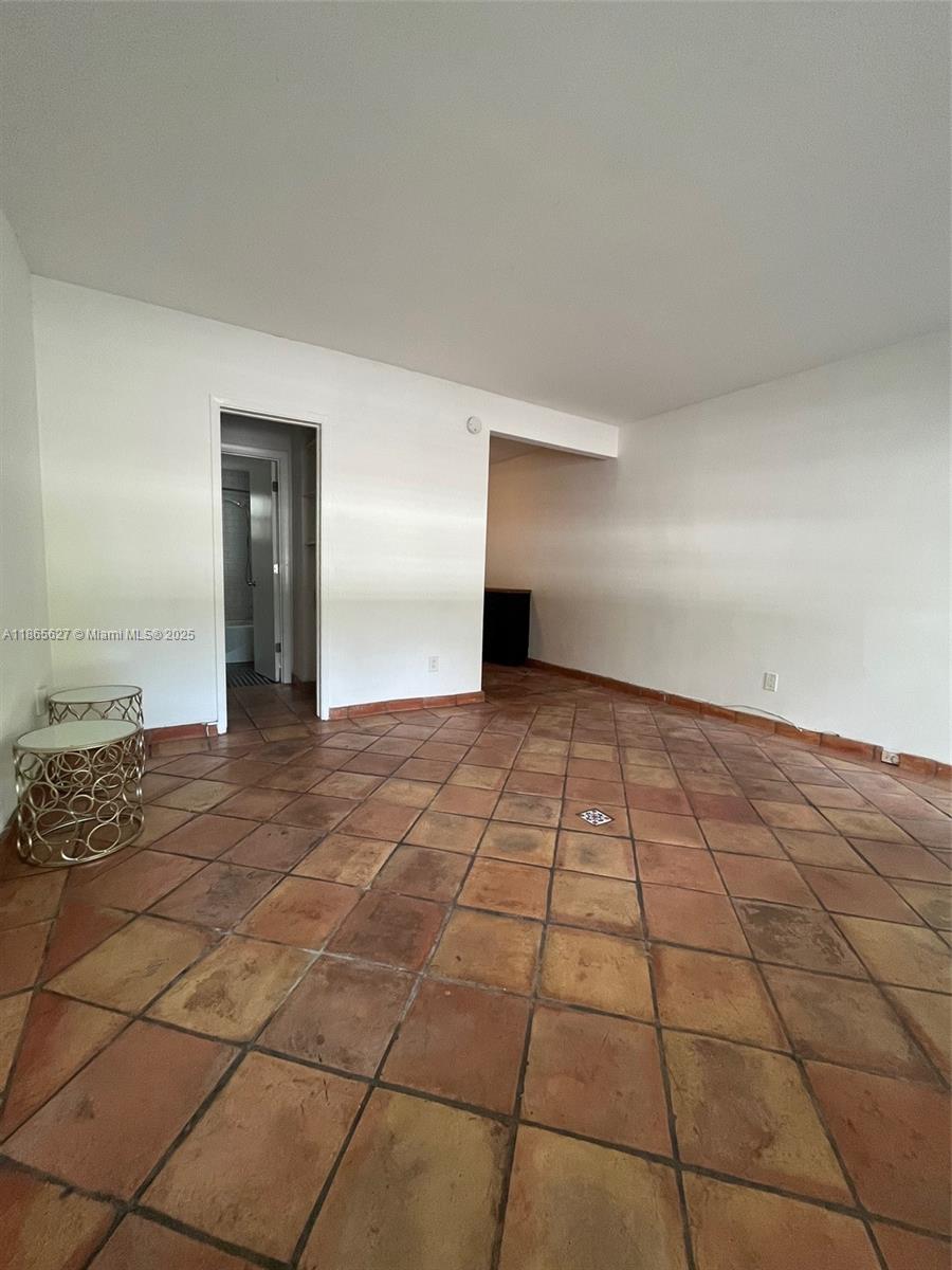 645 Northeast 77th Street, Unit 6 Miami, FL 33138 - Photo 7 of 10 a view of an empty room and window