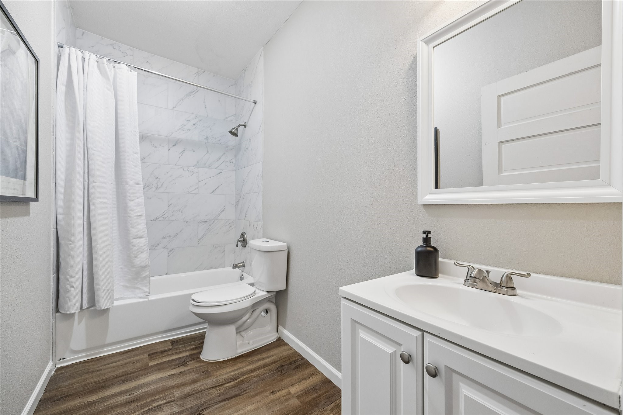 1812 Kane Street Houston, TX 77007 - Photo 11 of 41 a bathroom with a sink toilet and shower