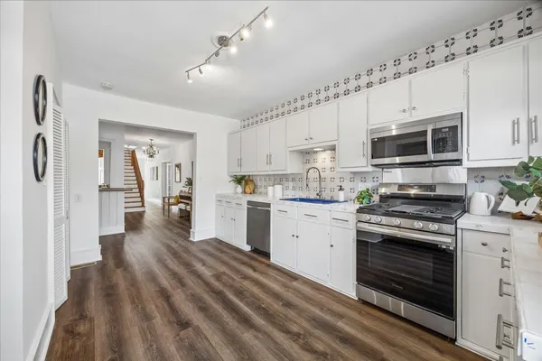 a kitchen with a sink and a stove