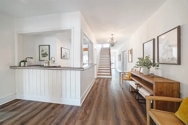 a view of a livingroom with furniture and wooden floor