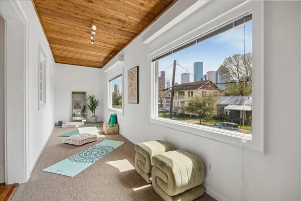 a view of balcony with wooden floor