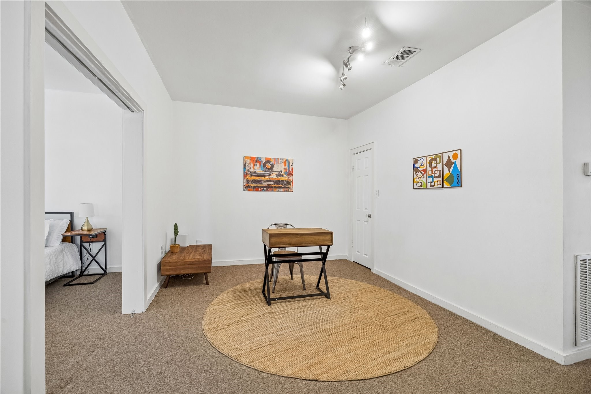 1812 Kane Street Houston, TX 77007 - Photo 24 of 41 a workspace with furniture and wooden floor