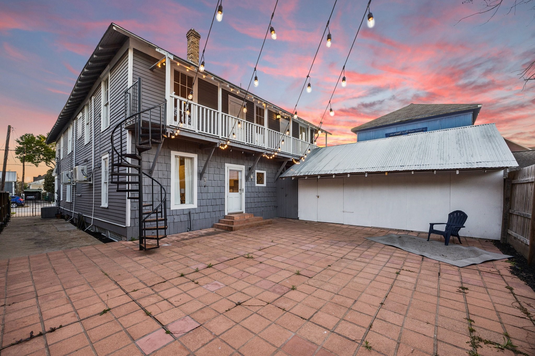 1812 Kane Street Houston, TX 77007 - Photo 34 of 41 a view of a house with backyard and a barbeque