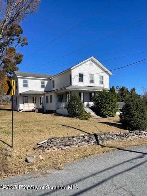 23 Village Road Beach Lake, PA 18405 - Photo 1 of 22 a front view of a house with a yard