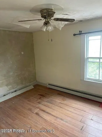 a bath tub sitting next to a shower