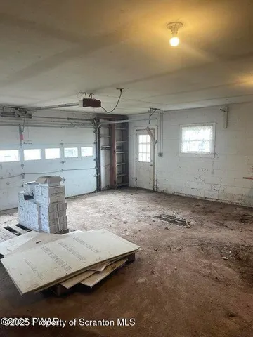 a view of a wooden house with a yard