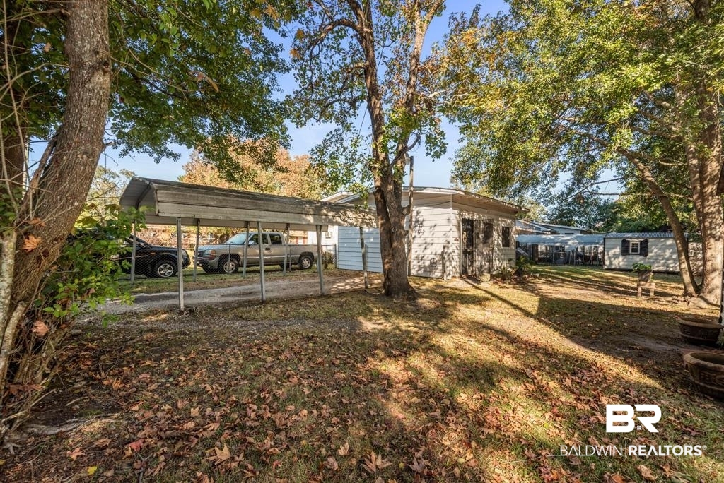 109 Esplanade Avenue Mobile, AL 36606 - Photo 40 of 45 View of home's exterior featuring a carport