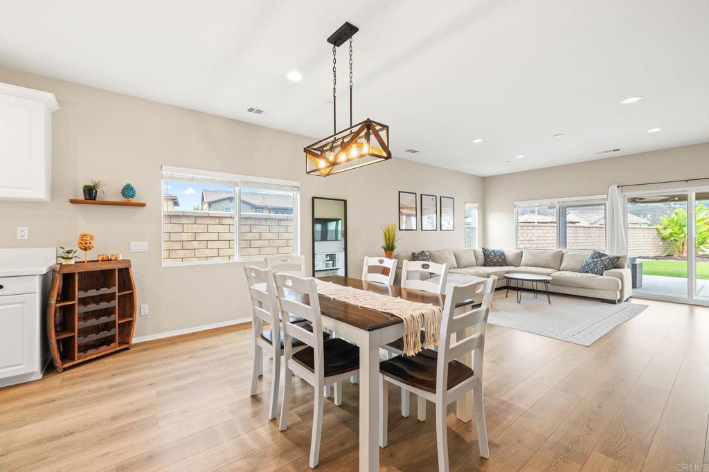 35846 Esperia Way Fallbrook, CA 92028 - Photo 16 of 60 a view of a dining room with furniture window and wooden floor