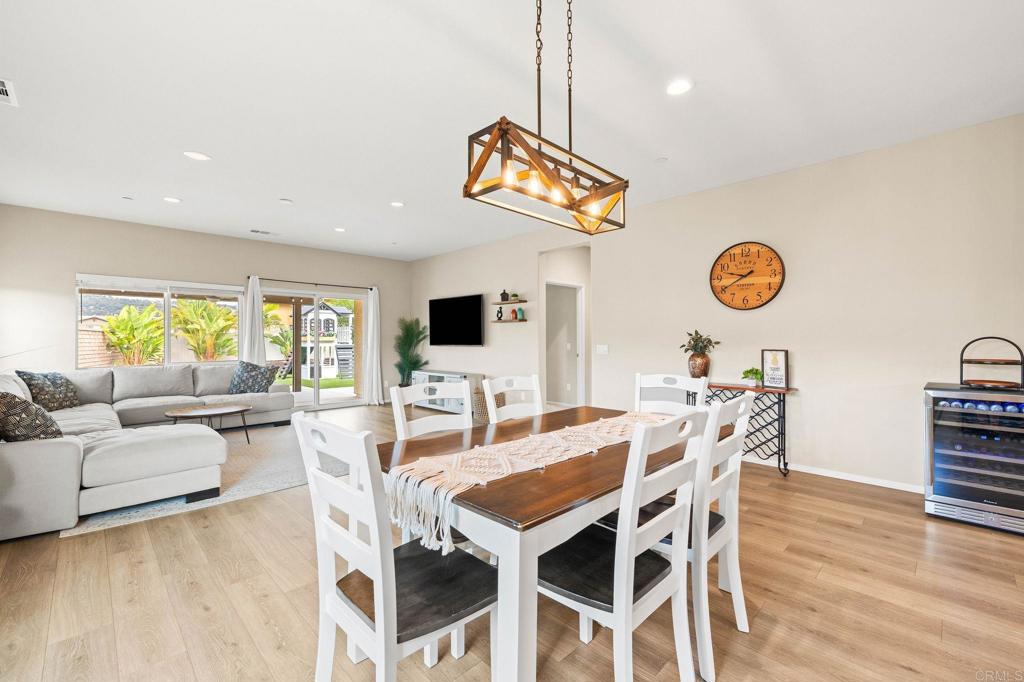 35846 Esperia Way Fallbrook, CA 92028 - Photo 17 of 60 a view of a dining room with furniture and wooden floor