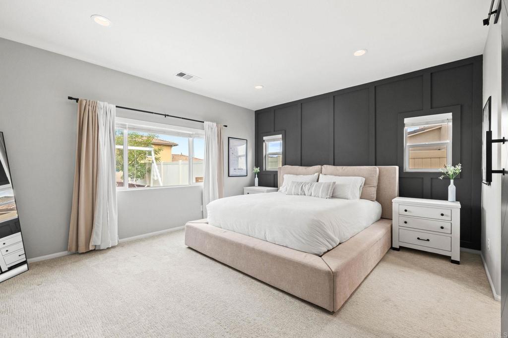 35846 Esperia Way Fallbrook, CA 92028 - Photo 21 of 60 a spacious bedroom with a bed and a window