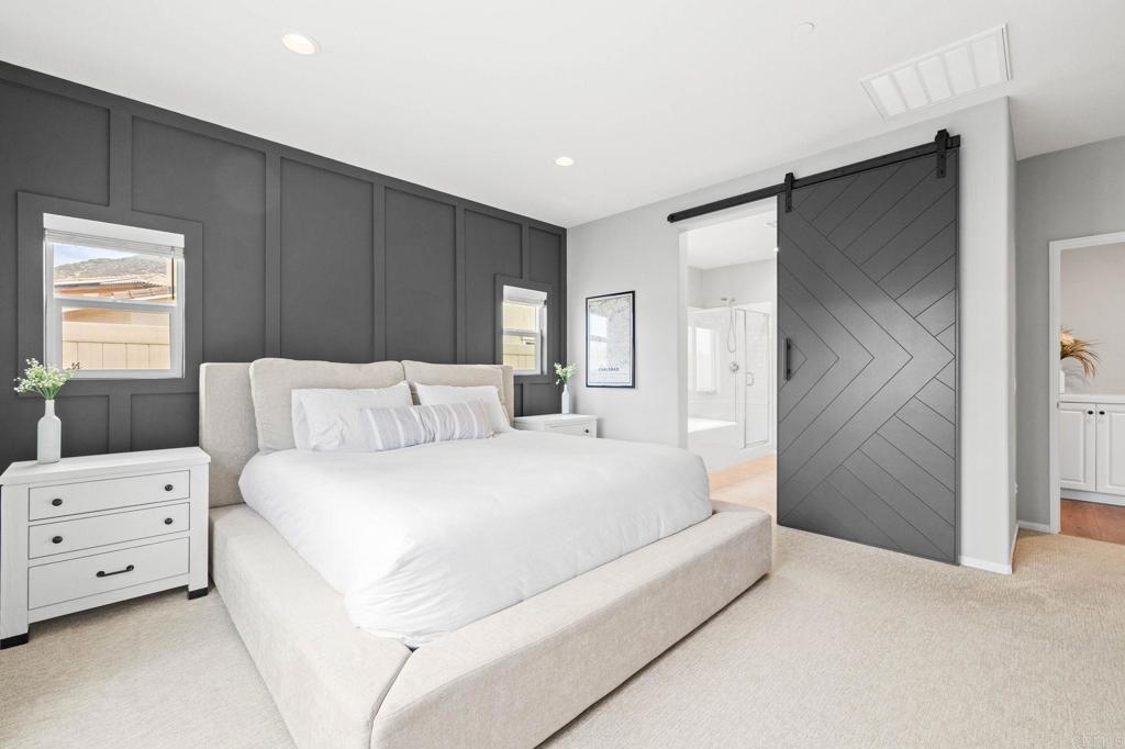 35846 Esperia Way Fallbrook, CA 92028 - Photo 22 of 60 a spacious bedroom with a bed and a cabinets