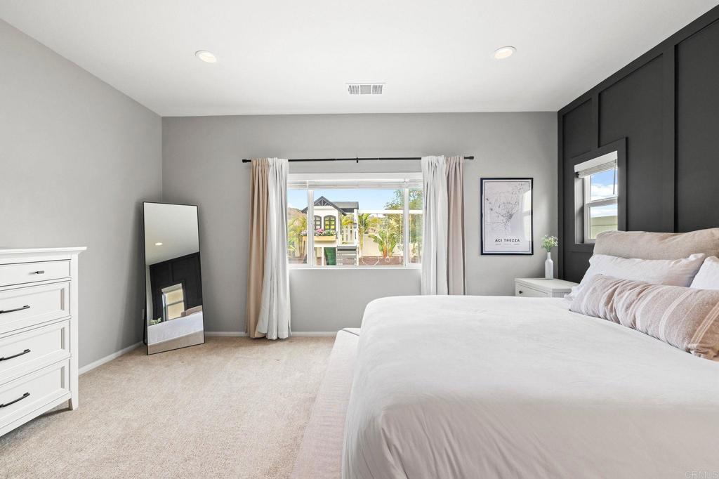 35846 Esperia Way Fallbrook, CA 92028 - Photo 24 of 60 a spacious bedroom with a large bed and a window