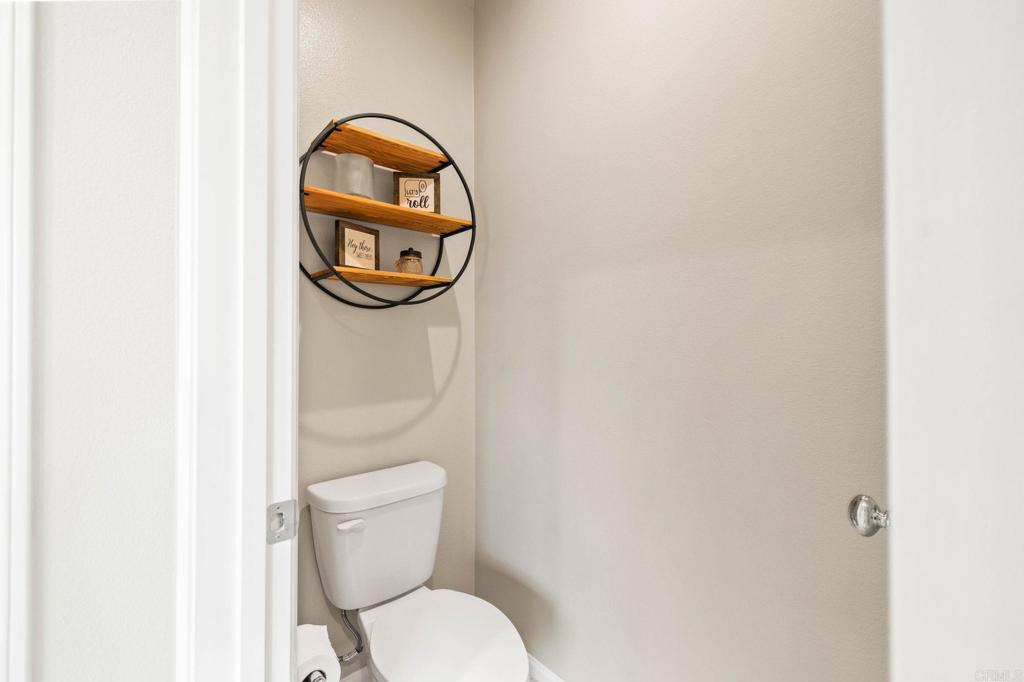 35846 Esperia Way Fallbrook, CA 92028 - Photo 30 of 60 a bathroom with a toilet and a sink