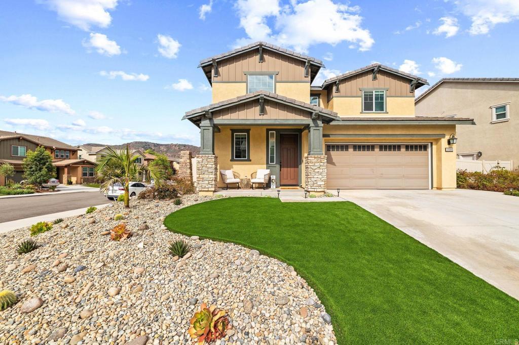 35846 Esperia Way Fallbrook, CA 92028 - Photo 3 of 60 a front view of a house with a yard and garage