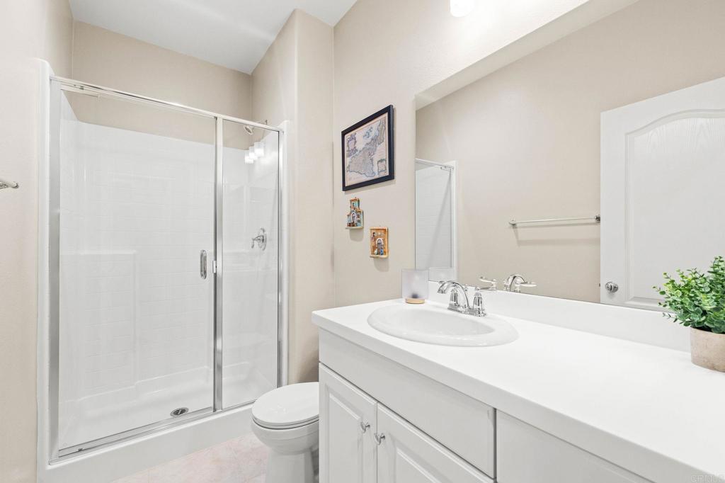 35846 Esperia Way Fallbrook, CA 92028 - Photo 35 of 60 a bathroom with a sink a toilet and shower