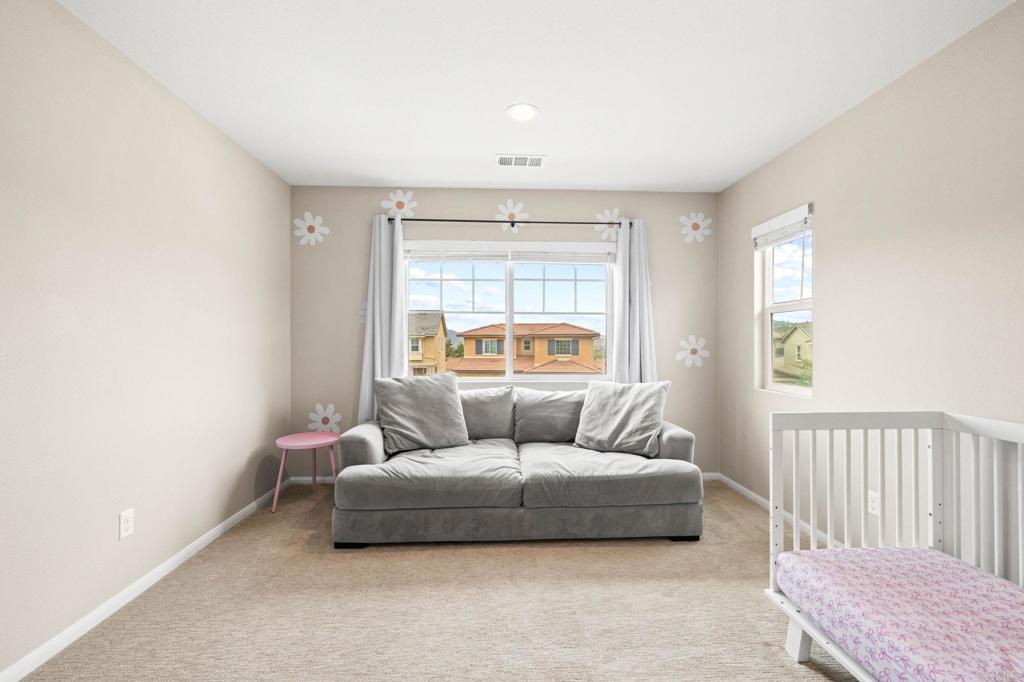 35846 Esperia Way Fallbrook, CA 92028 - Photo 39 of 60 a living room with a couch and a window