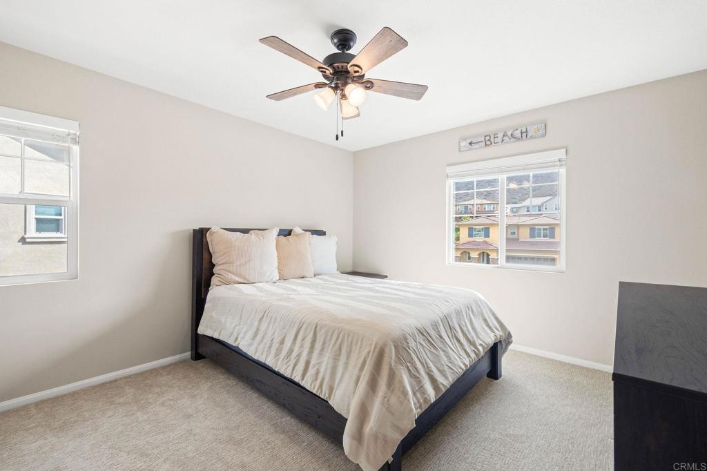 35846 Esperia Way Fallbrook, CA 92028 - Photo 41 of 60 a bedroom with a bed and window