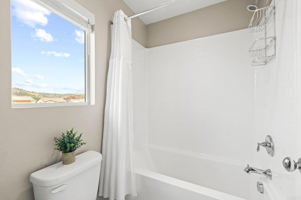 35846 Esperia Way Fallbrook, CA 92028 - Photo 47 of 60 a bath room with a toilet and a bath tub