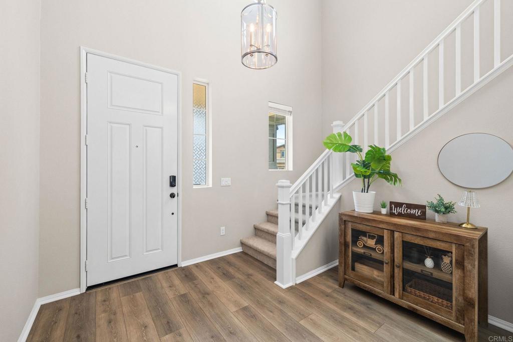 35846 Esperia Way Fallbrook, CA 92028 - Photo 8 of 60 a view of entryway with wooden floor and windows