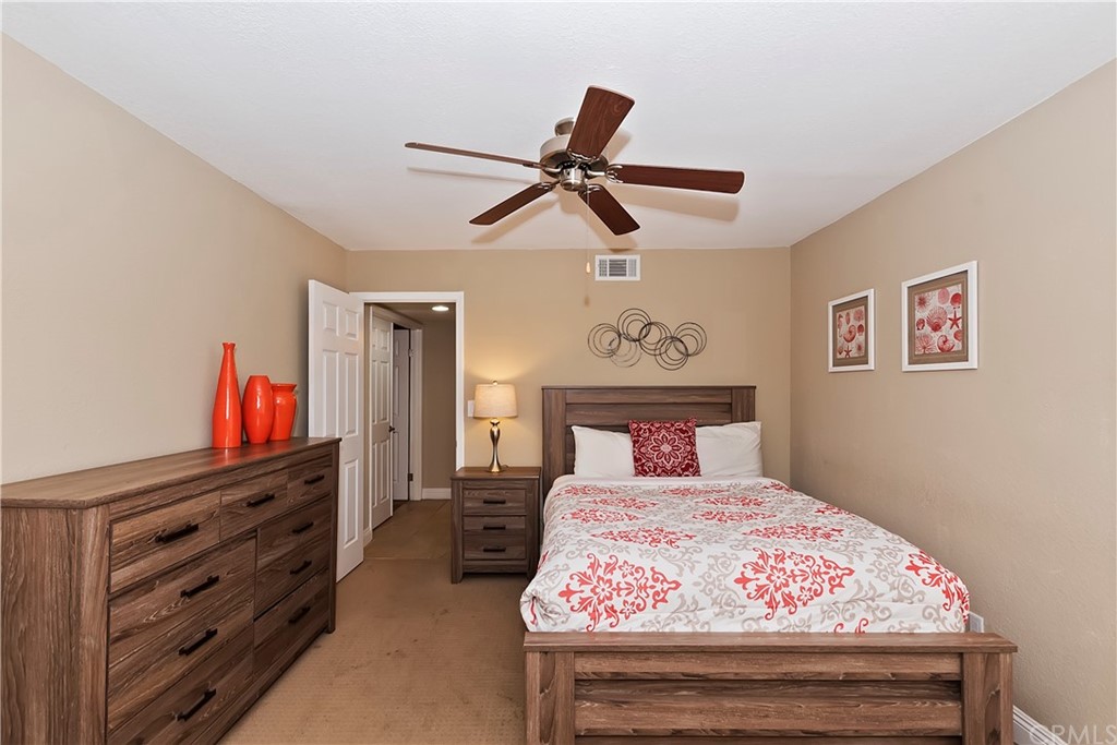 109 Torremolinos Drive Rancho Mirage, CA 92270 - Photo 18 of 33 a bedroom with a bed and a dresser