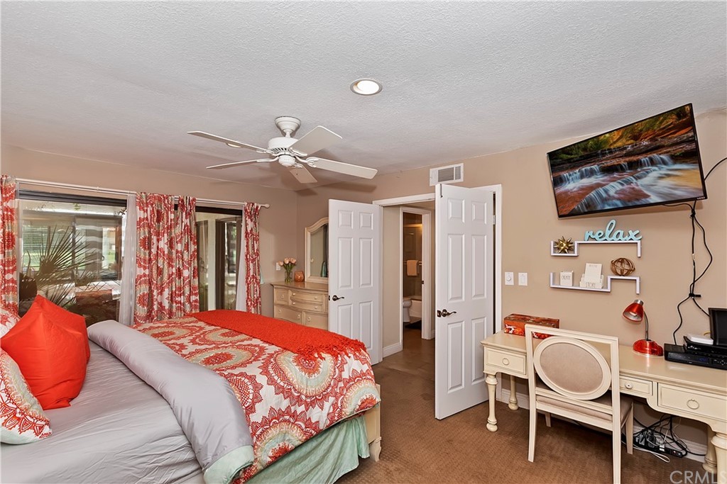 109 Torremolinos Drive Rancho Mirage, CA 92270 - Photo 20 of 33 a bedroom with a bed and furniture