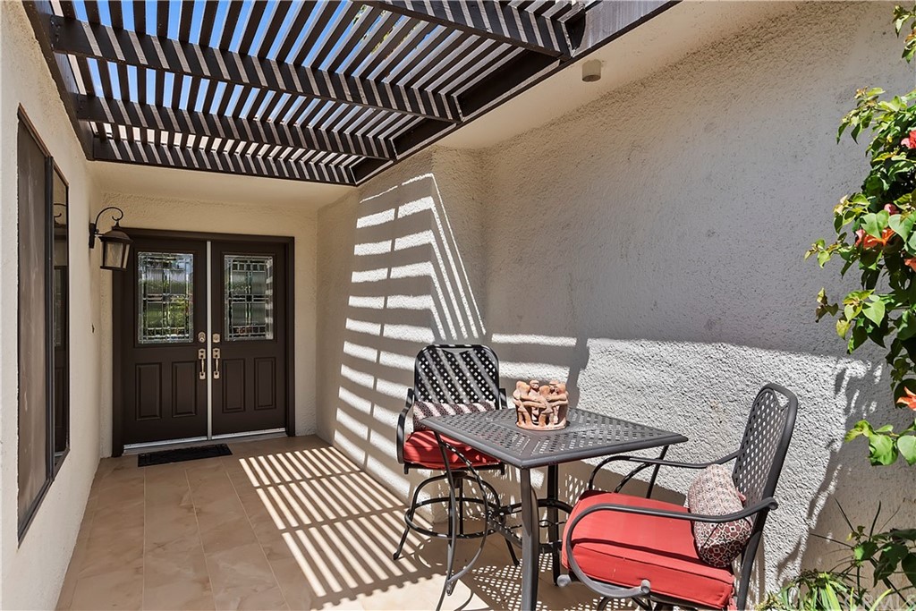 109 Torremolinos Drive Rancho Mirage, CA 92270 - Photo 2 of 33 a view of a patio with table and chairs and potted plants