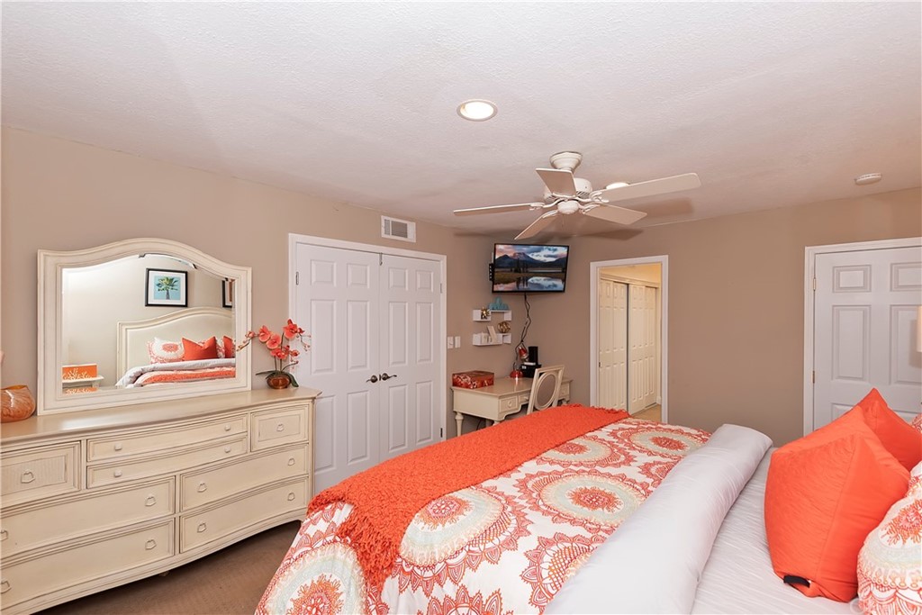 109 Torremolinos Drive Rancho Mirage, CA 92270 - Photo 21 of 33 a bedroom with a bed and a dresser