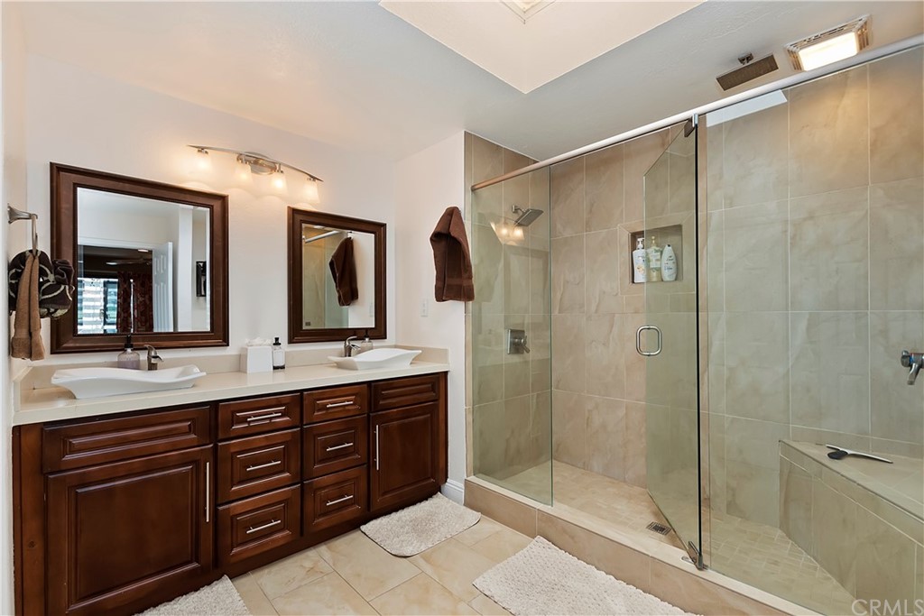 109 Torremolinos Drive Rancho Mirage, CA 92270 - Photo 24 of 33 a spacious bathroom with a shower sink mirror and