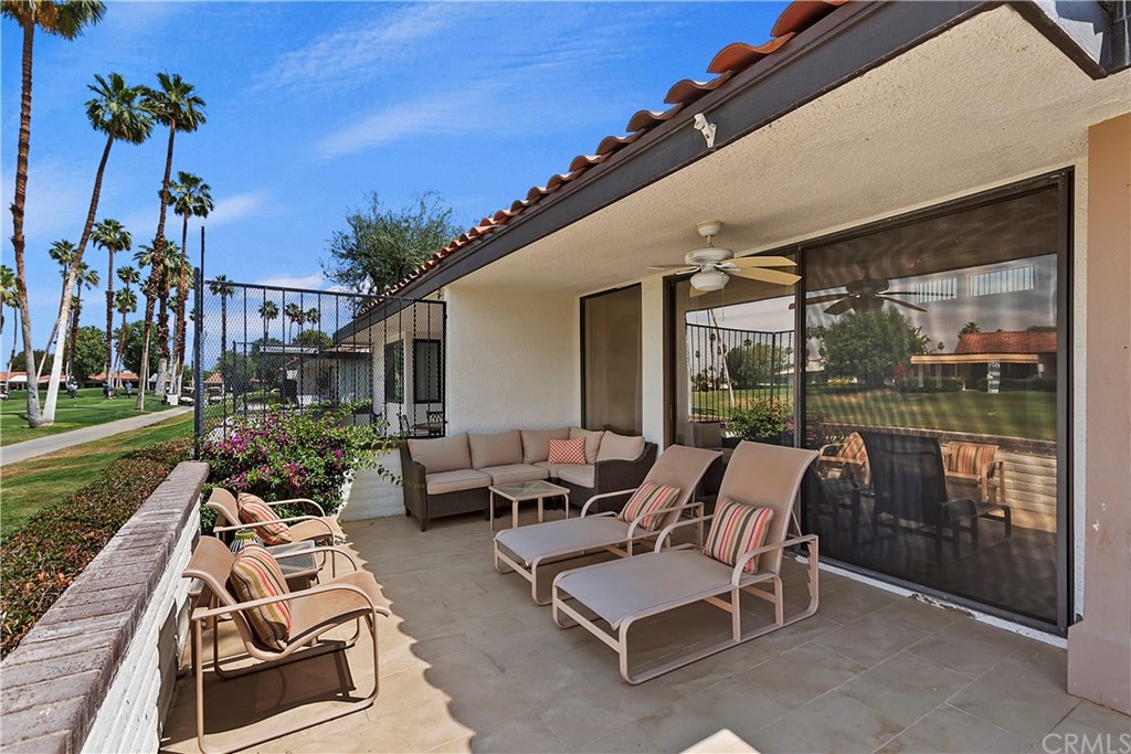 109 Torremolinos Drive Rancho Mirage, CA 92270 - Photo 30 of 33 a view of a patio with couches table and chairs and potted plants