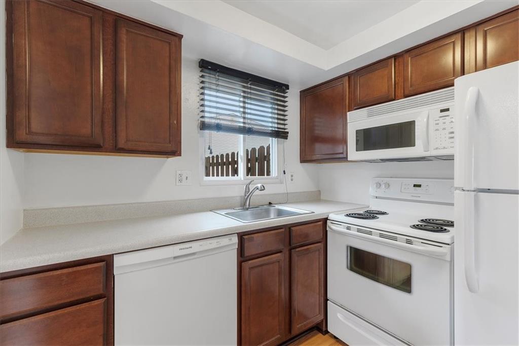 78 Seavey Road Pittsburgh, PA 15223 - Photo 7 of 29 Warm wood cabinets provide ample storage space in the kitchen.