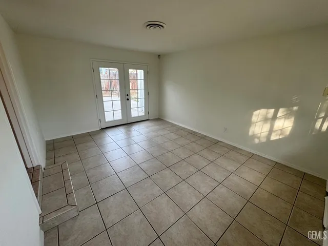 a view of empty room with windows