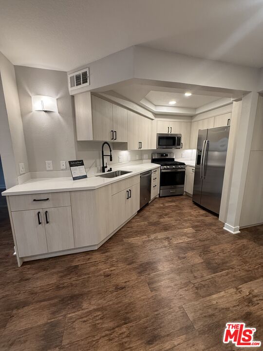 7660 Beverly Boulevard, Unit 237 Los Angeles, CA 90036 - Photo 1 of 7 a large kitchen with stainless steel appliances granite countertop a stove a sink dishwasher and a refrigerator