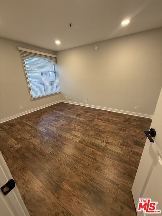 7660 Beverly Boulevard, Unit 237 Los Angeles, CA 90036 - Photo 3 of 7 an empty room with windows
