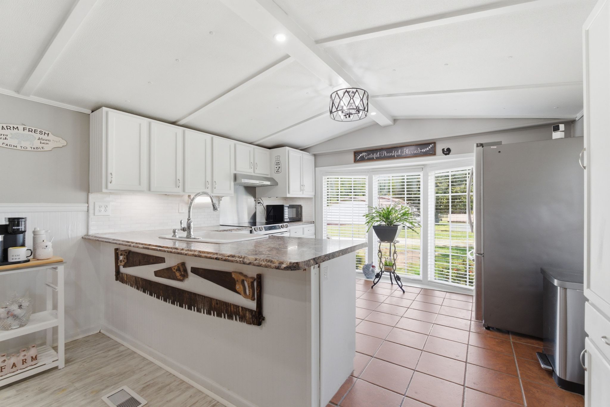 404 Logan Chapel Road Hillsboro, TN 37342 - Photo 6 of 38 a kitchen with stainless steel appliances granite countertop a stove and a sink