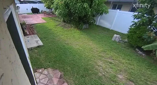 a backyard of a house with lots of green space