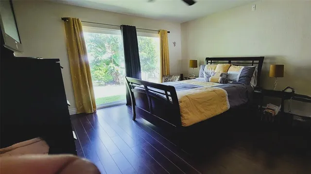 a bed sitting in a bedroom next to a window