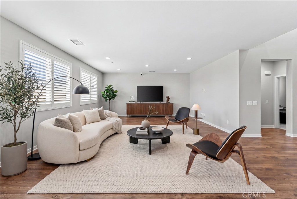 36772 Arietta Way Beaumont, CA 92223 - Photo 16 of 45 a living room with furniture and a flat screen tv