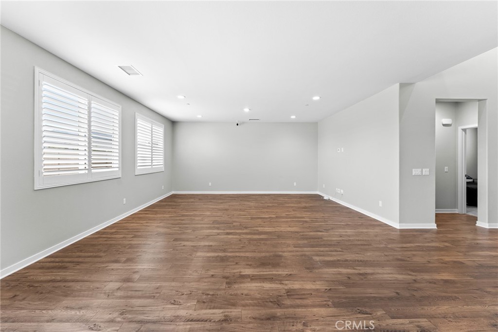 36772 Arietta Way Beaumont, CA 92223 - Photo 17 of 45 a view of empty room with wooden floor and fan