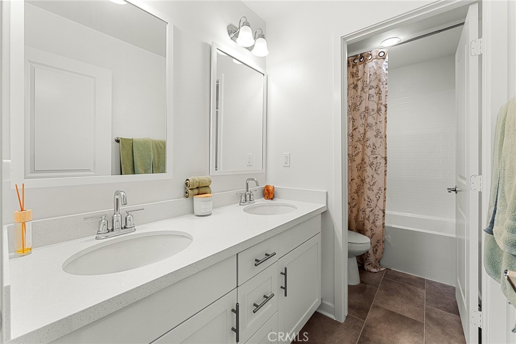 36772 Arietta Way Beaumont, CA 92223 - Photo 29 of 45 a bathroom with a sink double vanity and a tub